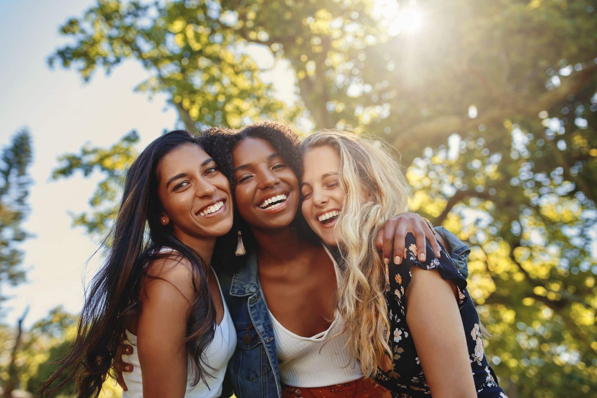 Friends hugging and smiling